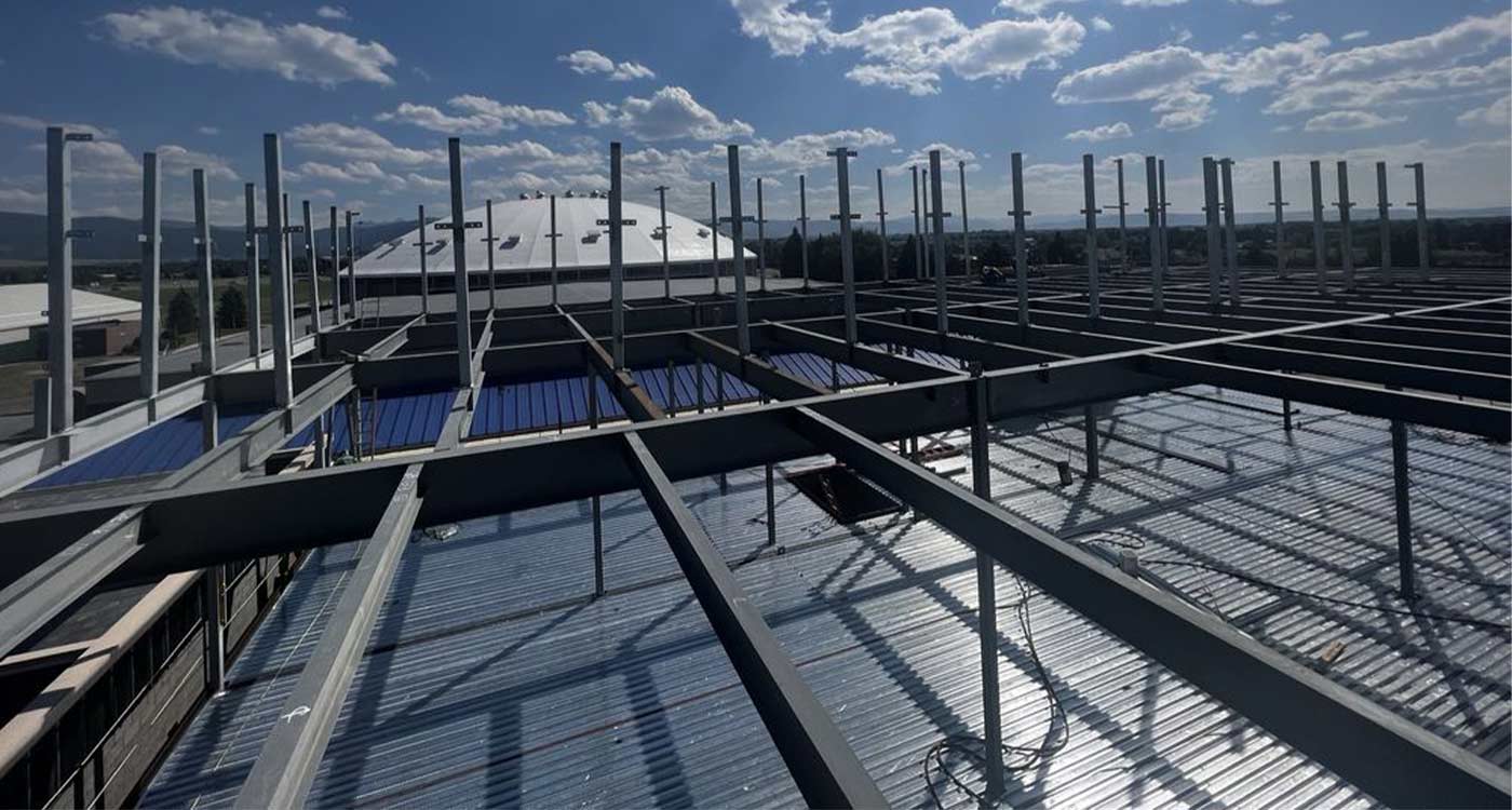 Steel roof framing and purlins on a large building under construction